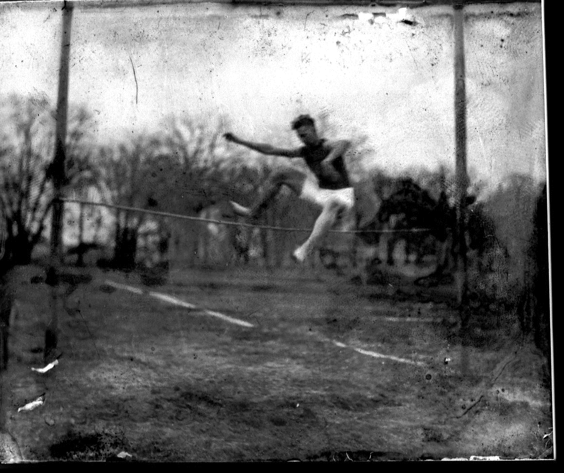 photo of Athlete Performing a High Jump