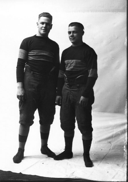photo of Two Unidentified Cornell Students in Football Uniforms