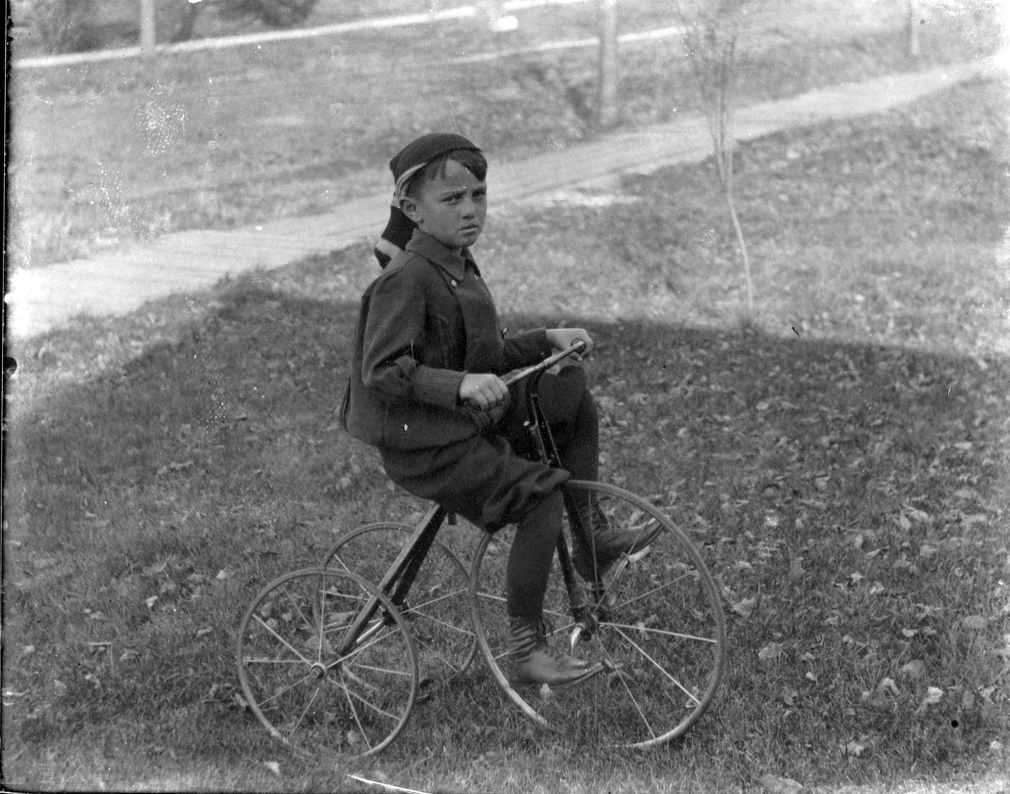 photo of Unidentified Boy Riding Tricycle