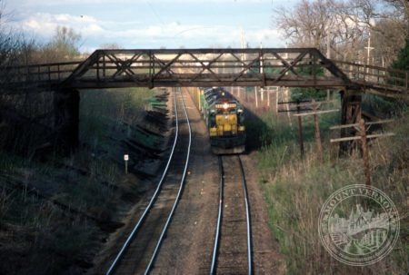 Photo of train under Old Lincoln Highway Bridge