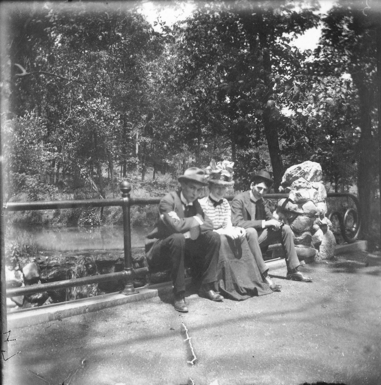 photo of Unidentified Men and Woman on a Bridge