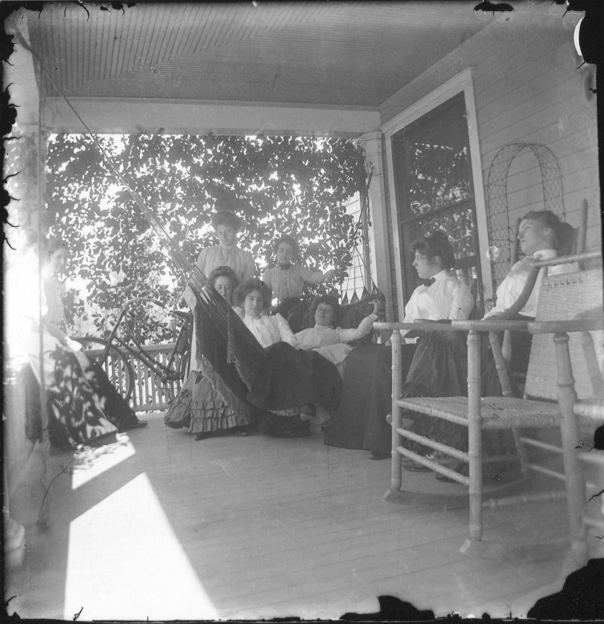 photo of Unidentified Women Sitting Outside on a Porch