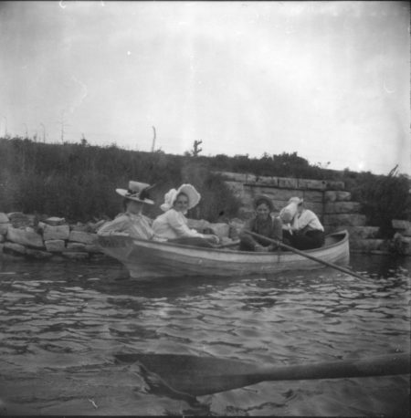 photo of Unidentified Women and Man in a Rowboat