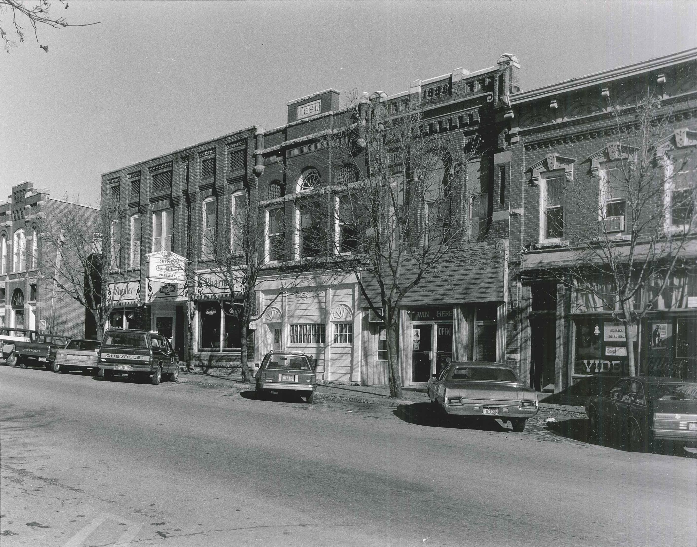 Photo of north side of First Street W. Photographed 1990