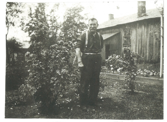 Photo of Martin Shantz in front of his blacksmith shop