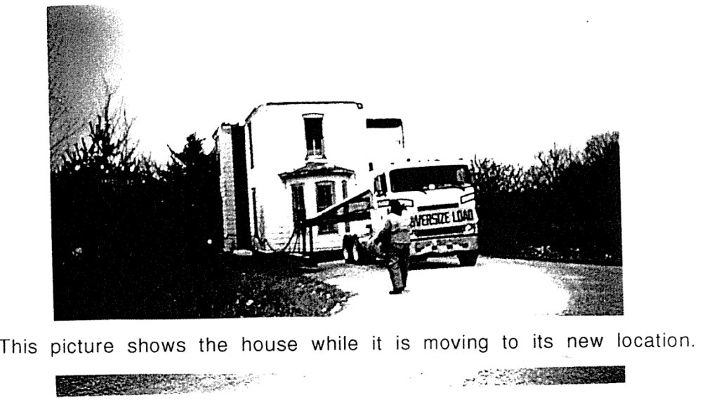 House being moved by a trailer.