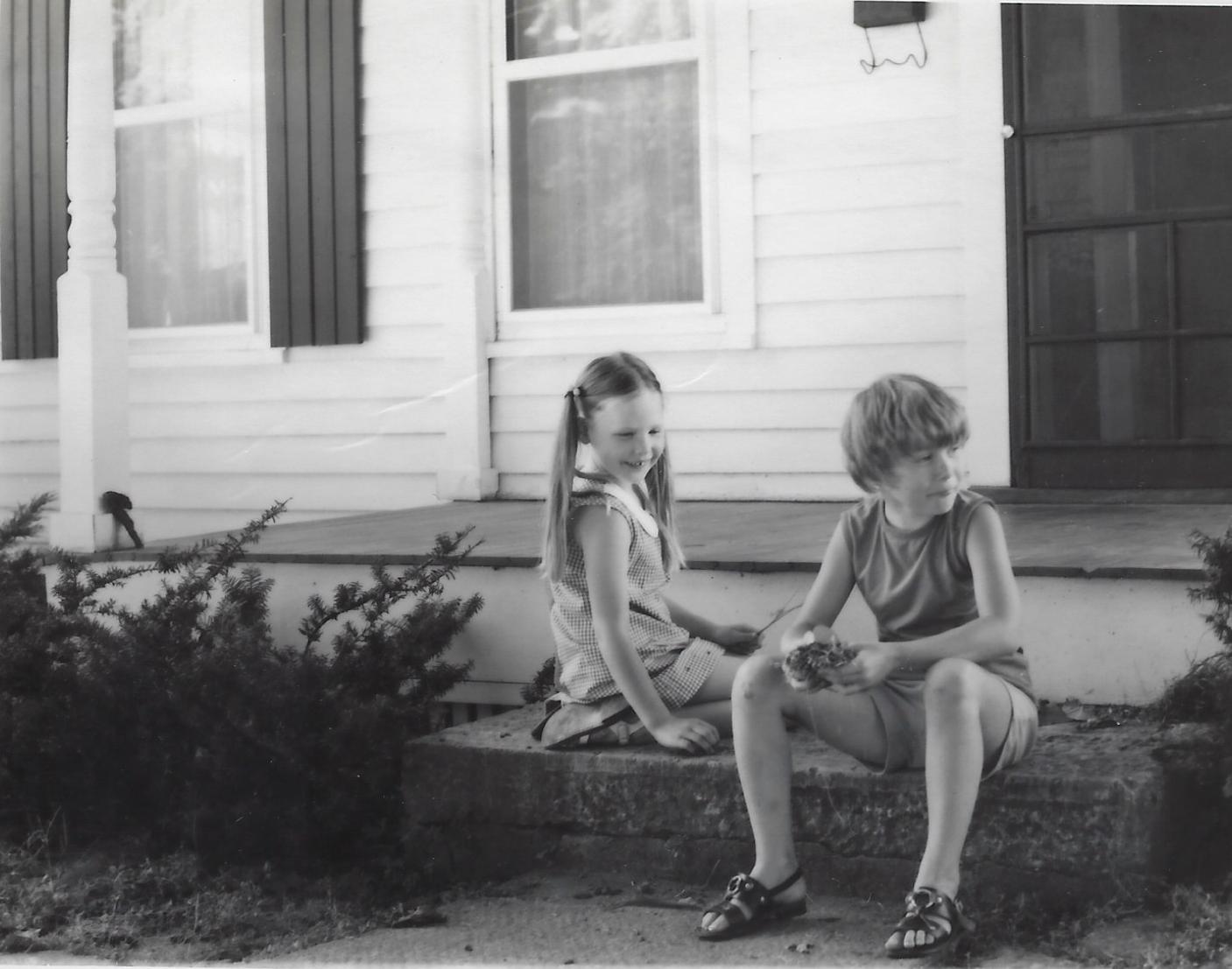 Photo of two girls playing on the front steps