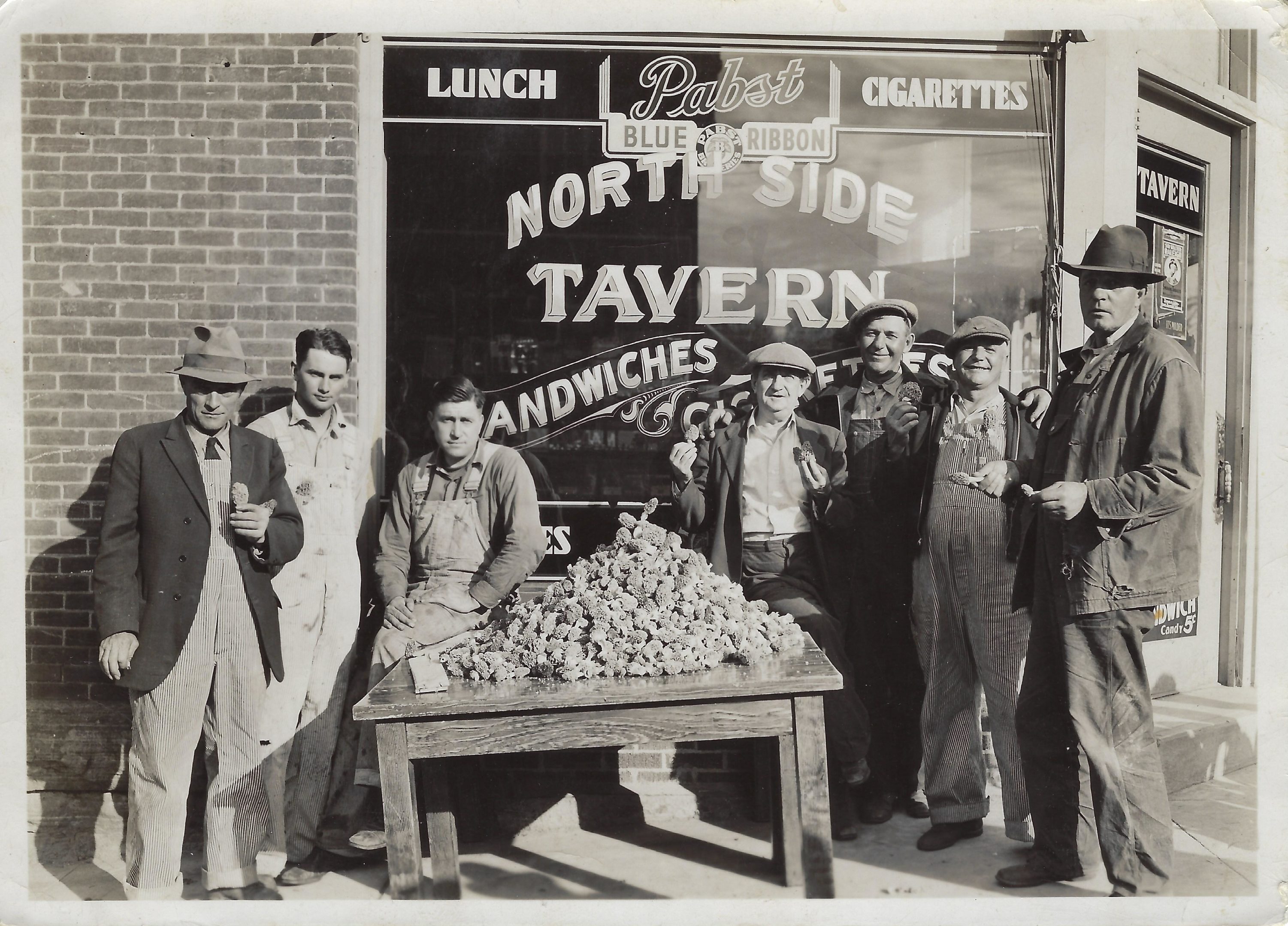 Photo of mushroom hunters in front of Northside Tavern. @ 1939