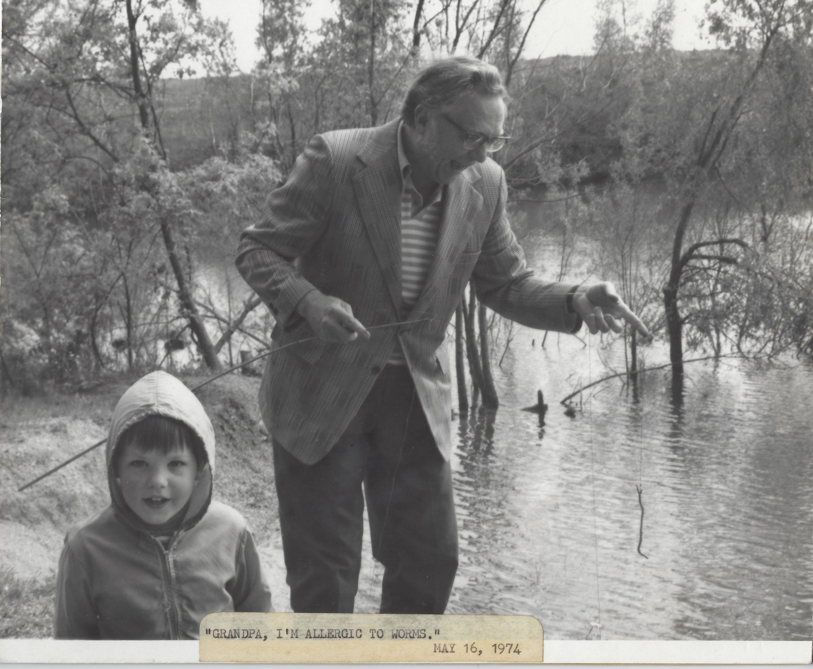 Photo of Warren Sutherland fishing with Grandpa Herman Rolufs. 1974
