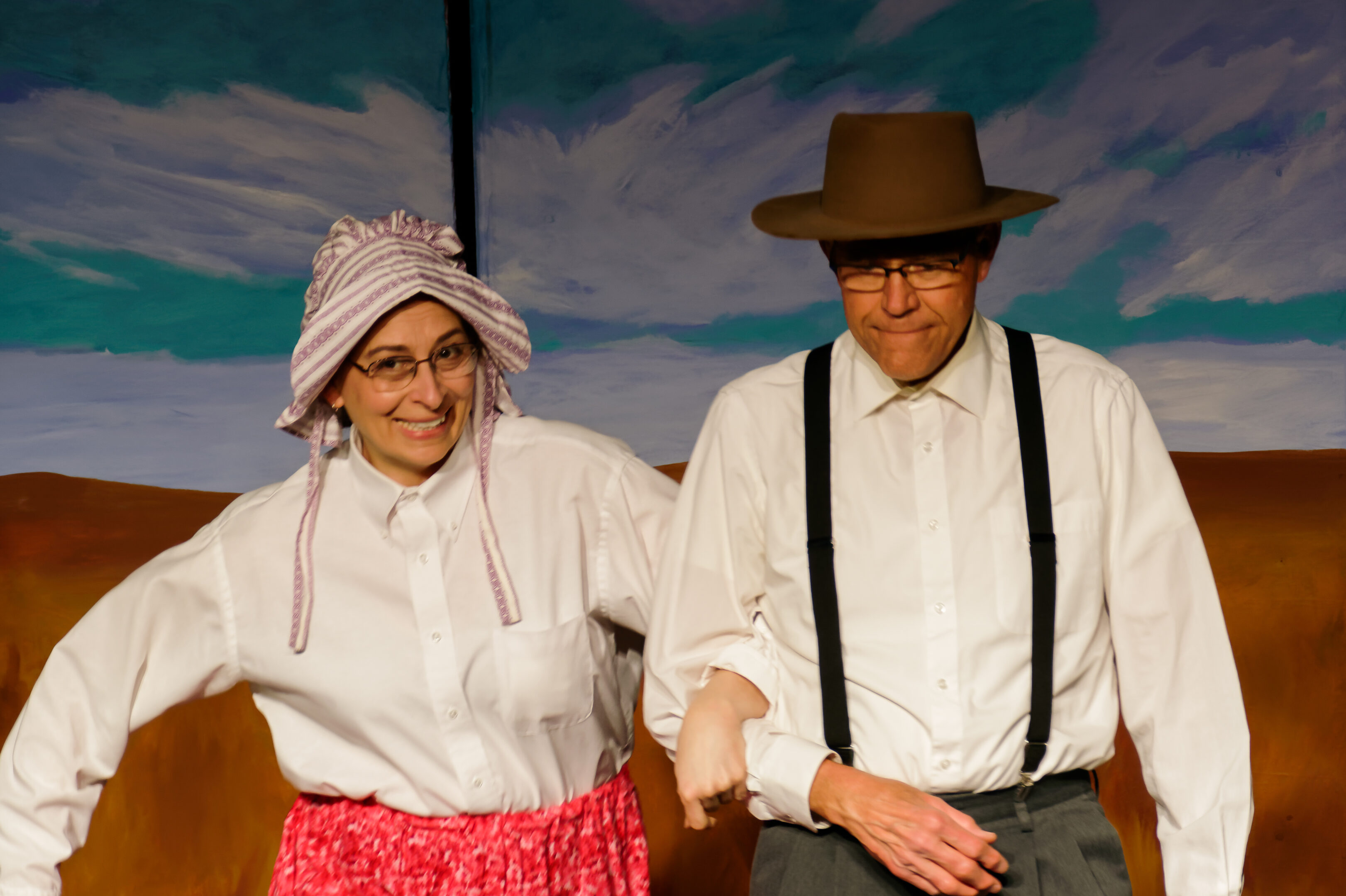 2023-Treasure Play-Kim Benesh as Mary Abbe links arms with Larry Hansen as William Abbe