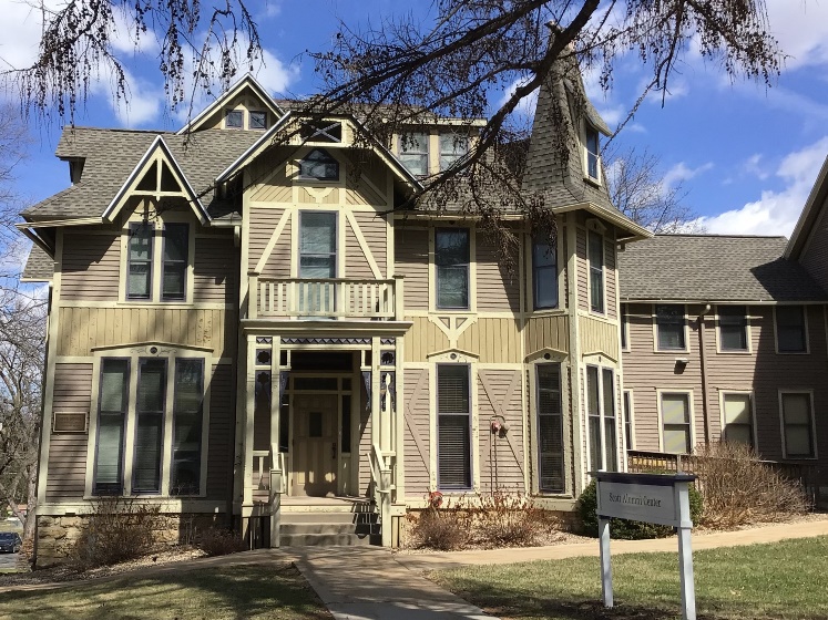 eclectic 3-story wooden home with many different angles and roof pitches.  Example of The Stick style.
