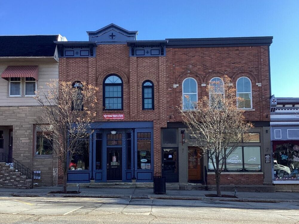 Photo of modern Main St, Mount Vernon, Iowa.  Attractive and freshly renovated  buildings are shown.