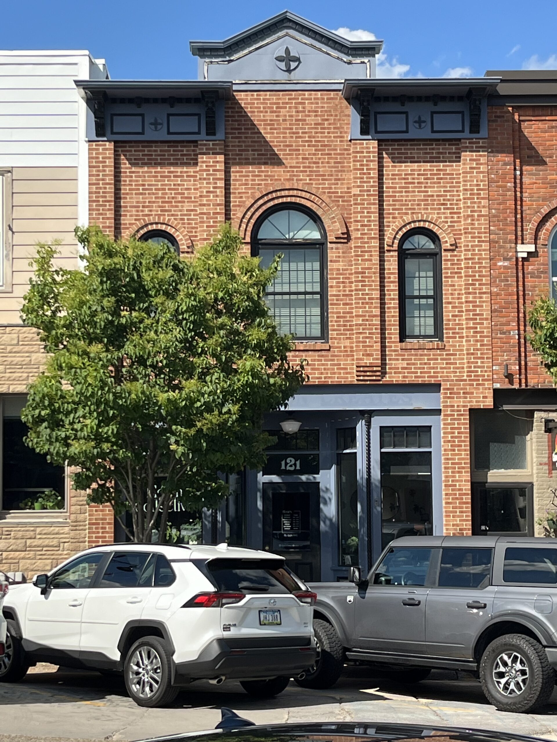 Photo of a brick building that houses Bloom Collective.
