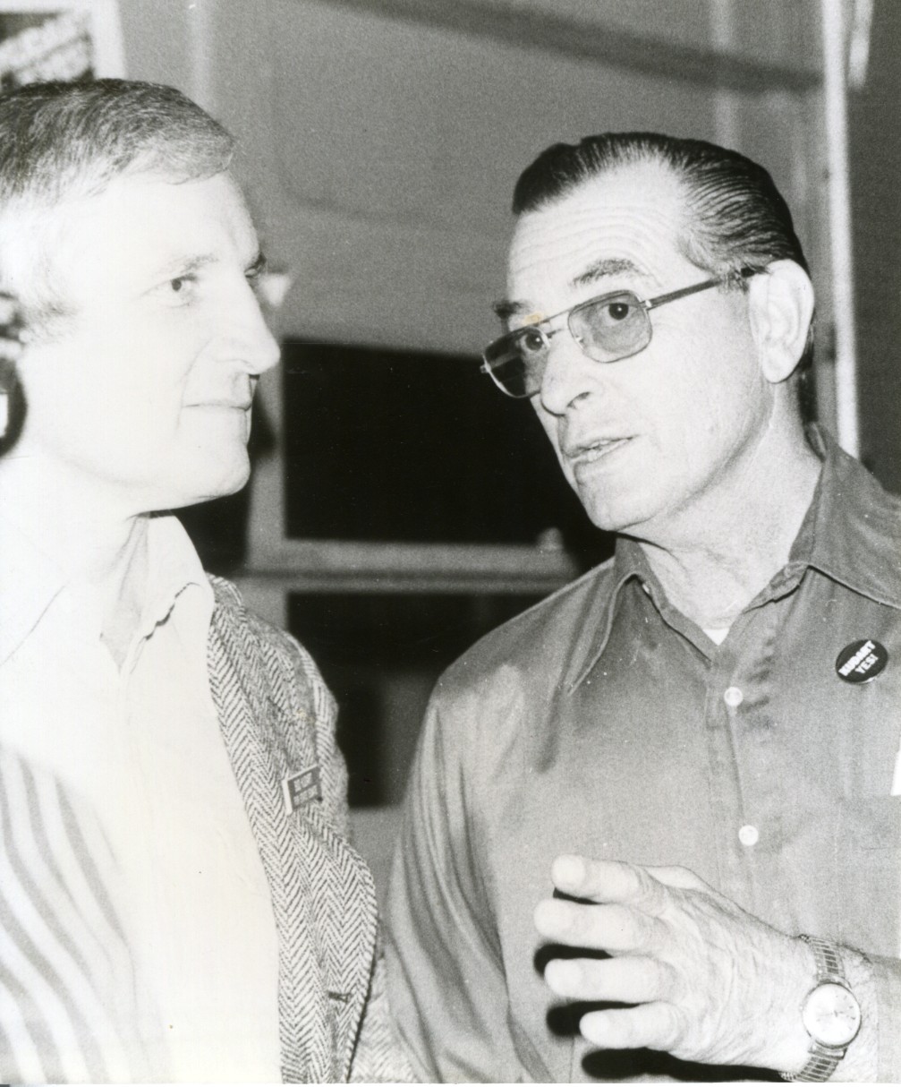 Photo of Bud Kudart talking to George Petrick.