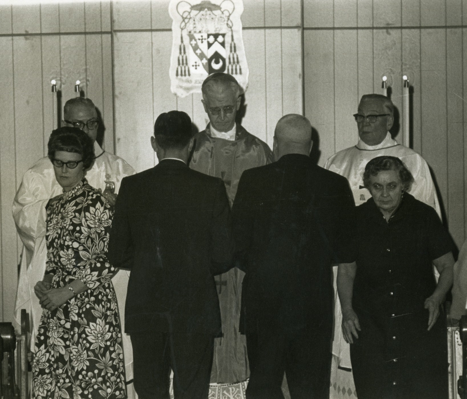 Photo of Archbishop Byrne administering the holy sacrament.