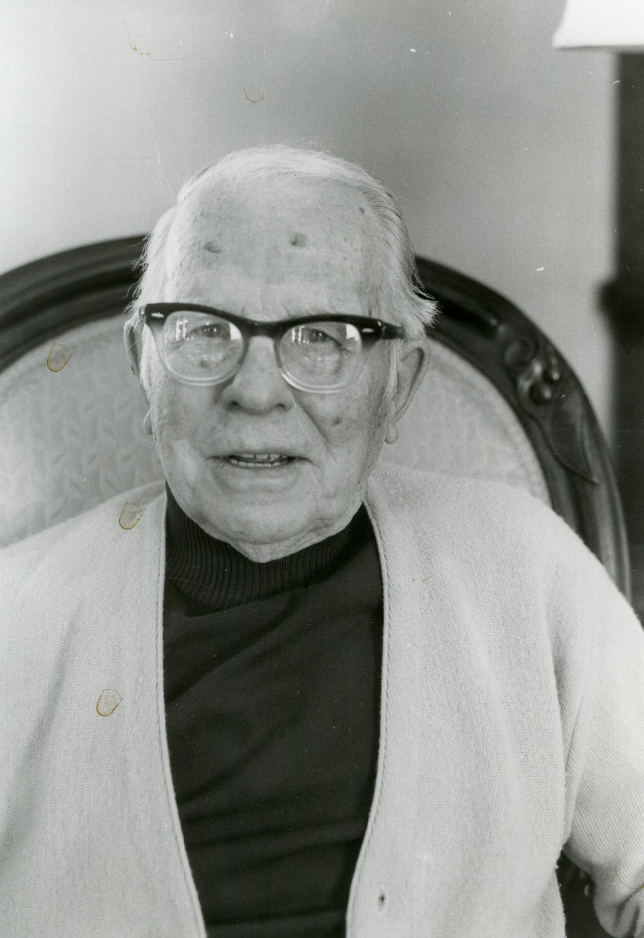 Photo of Fred Young when he was older sitting in a chair.