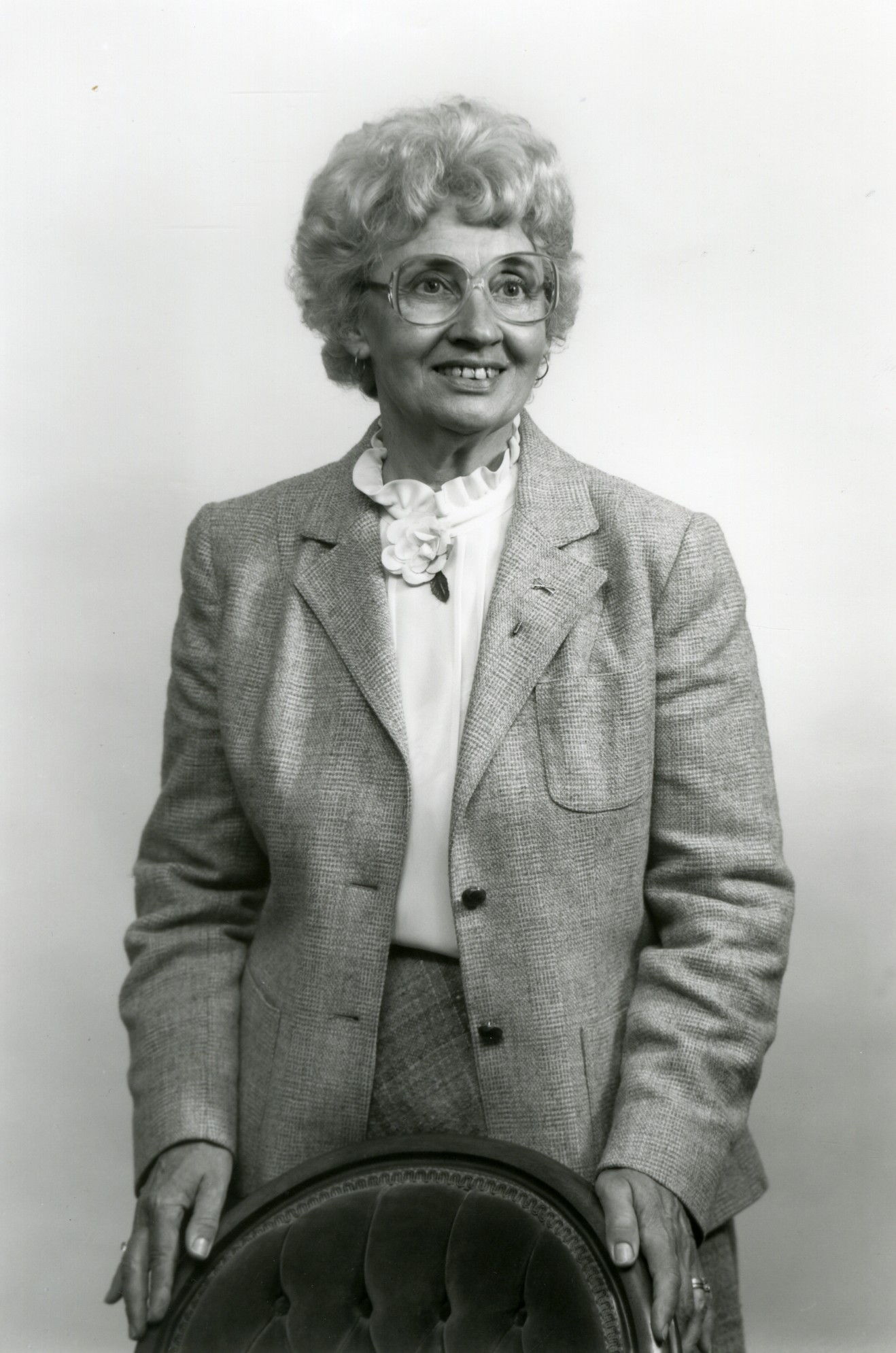 Photo of Joanne Petrick wearing a suit with white blouse.