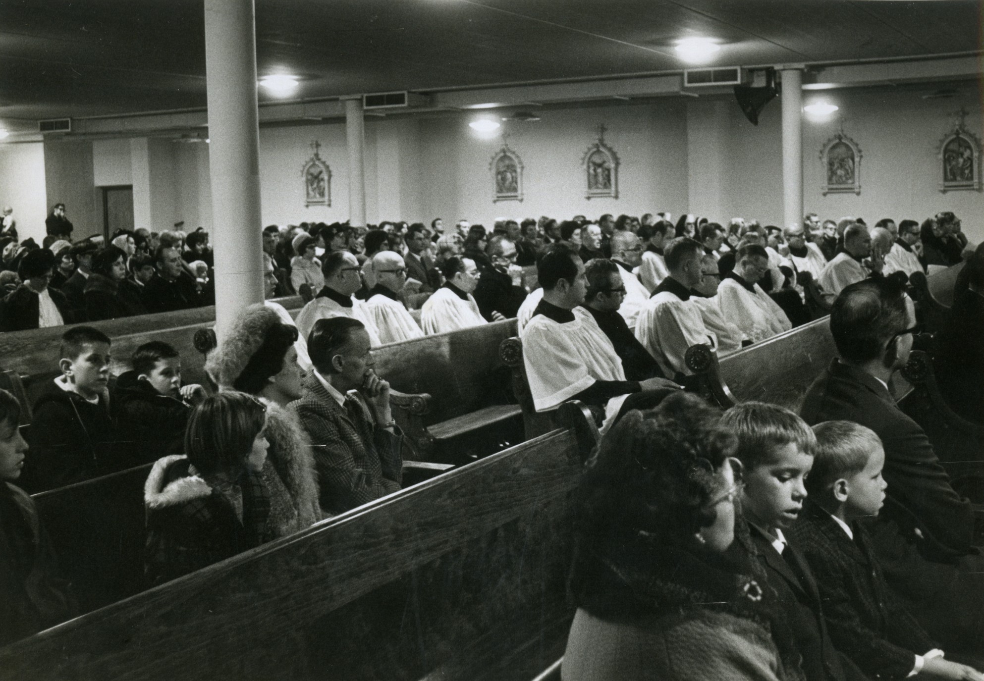 Photo of the congregation seated in the new basement of St. John's Catholic Church.