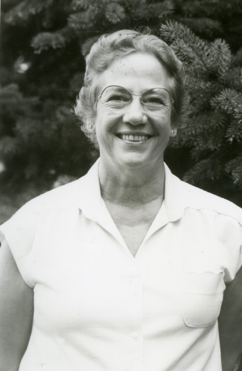 Black and white photo of Arlene Brown standing outside.