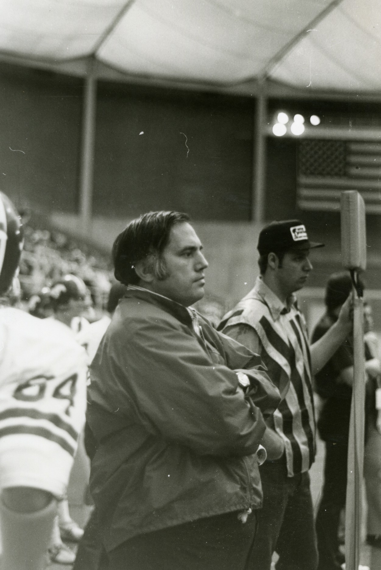 Black and white photo of coach Jim Bellamy at a football game.